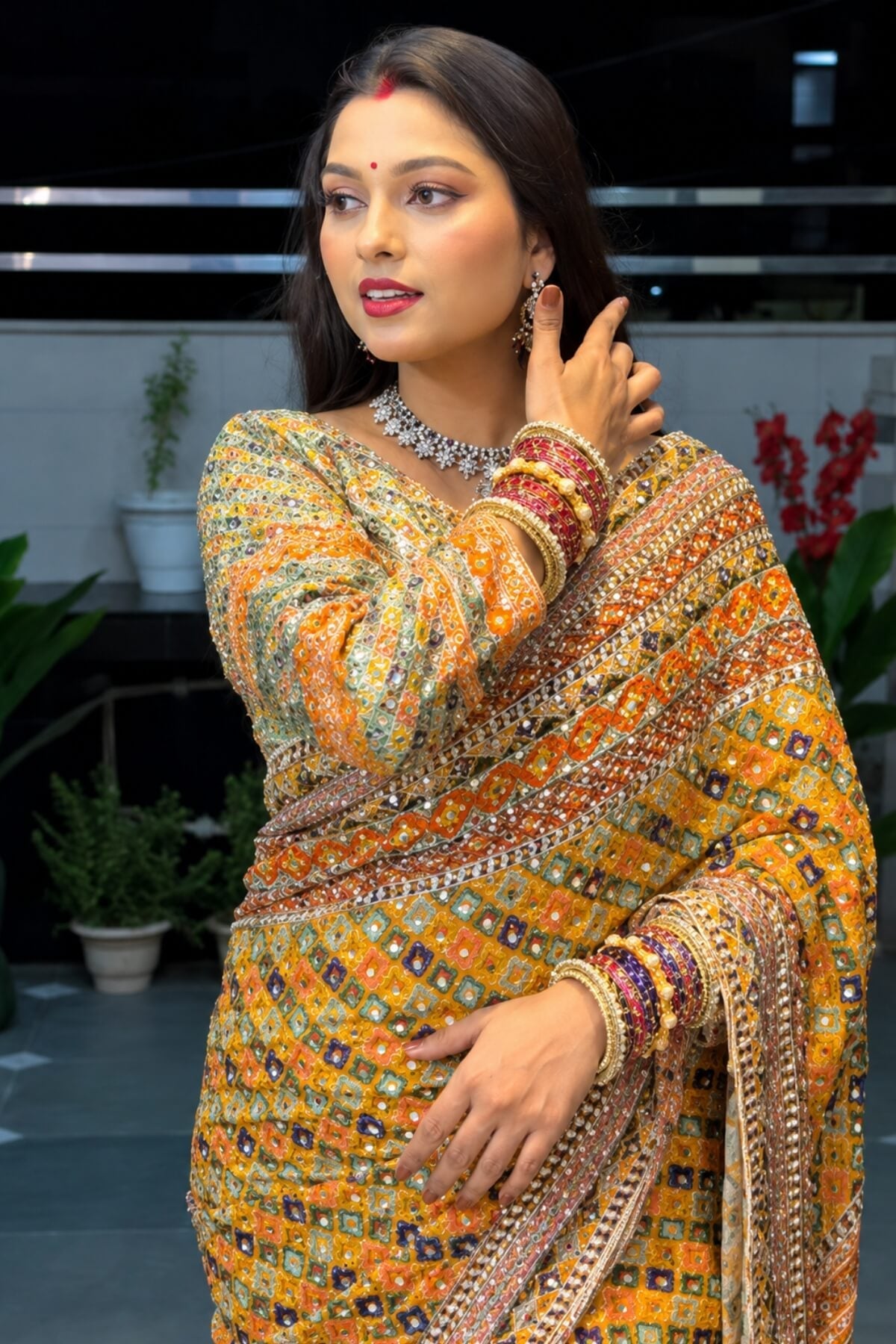 Yellow Chinon silk saree with zari woven and mirror work detail