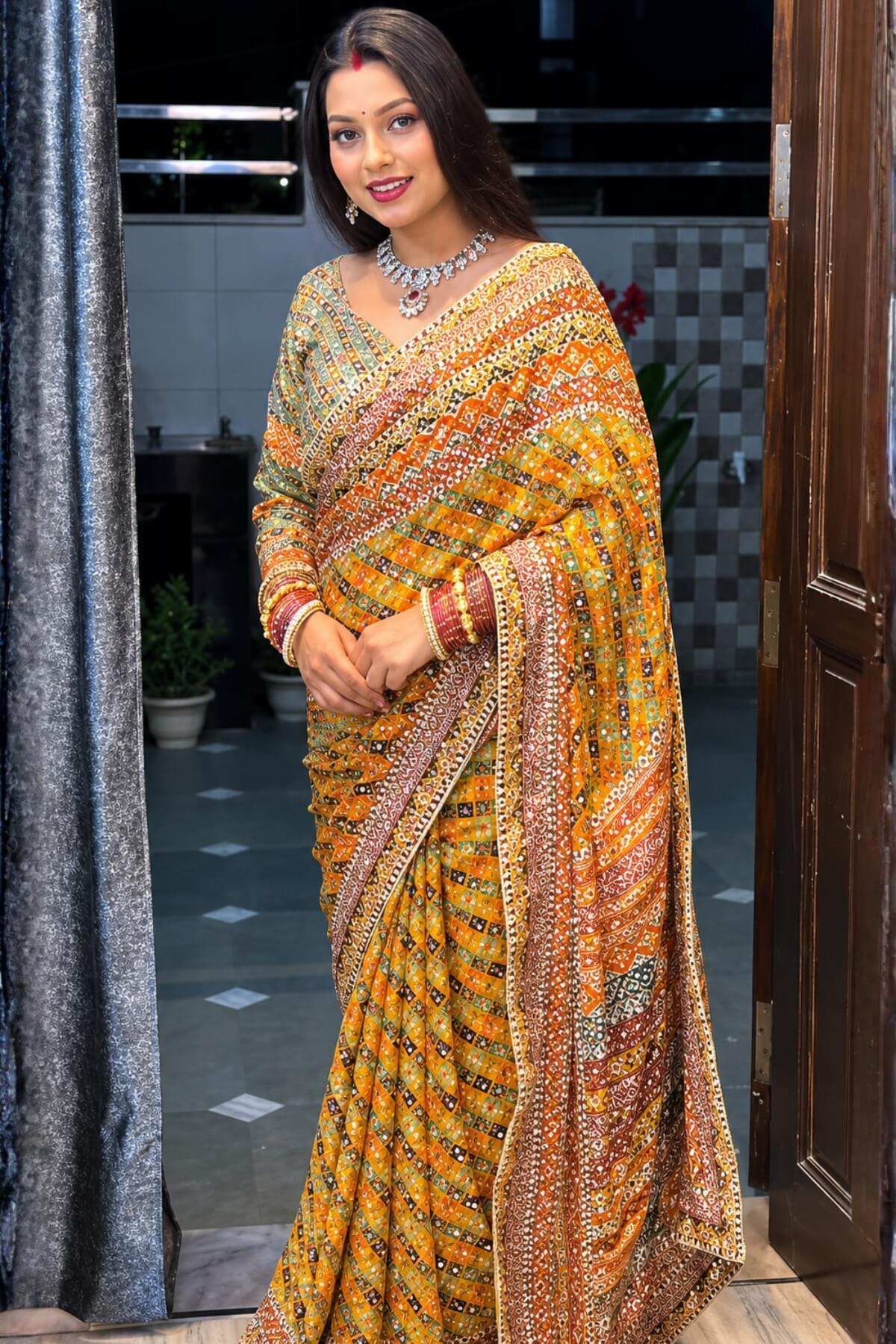 Yellow printed mirror work saree - pallu detail