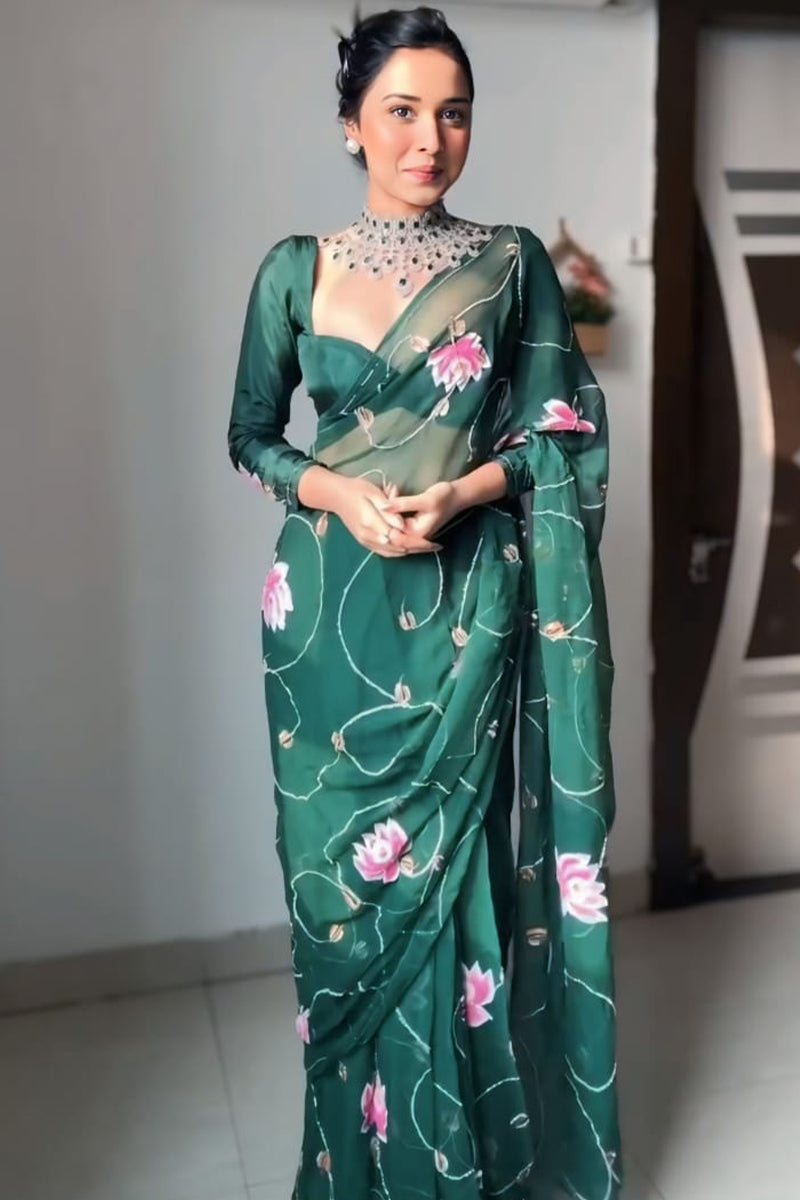 Dark green organza party wear saree side pose